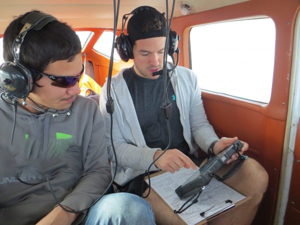 DUC and Akaitcho technicians analyze remote sensing data via aerial surveys.