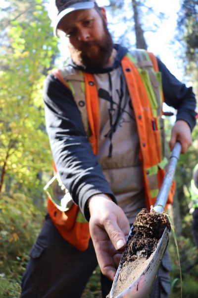 DUC Conservation Specialist Rick Murray shows a fresh sample of peat from a wetland